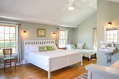 Bedroom in the Old Laundry with a king-size bed and twin bed against the wall